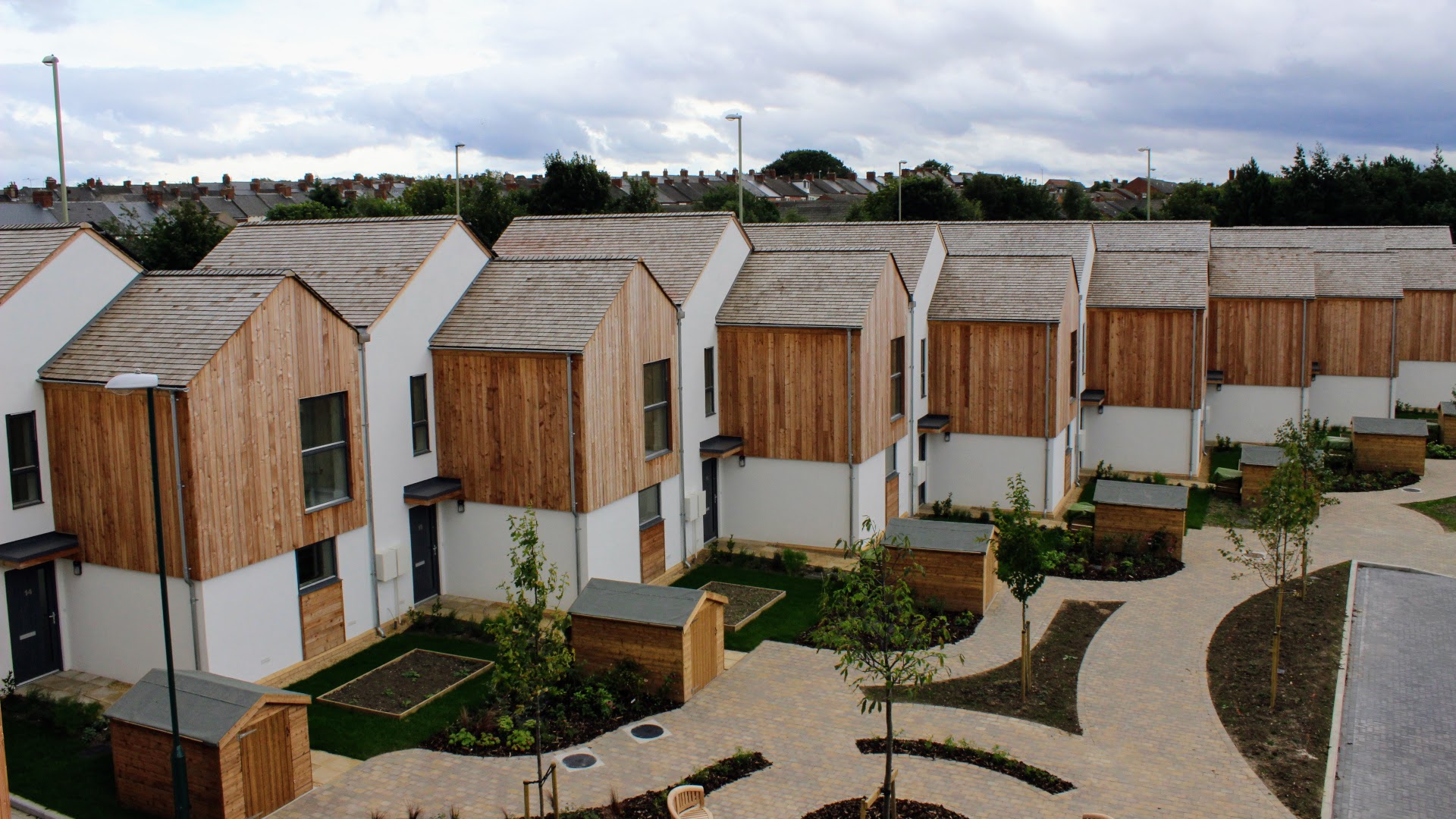 A photograph of the Sinclair Meadows carbon negative social housing development, this part is nine terraced houses.