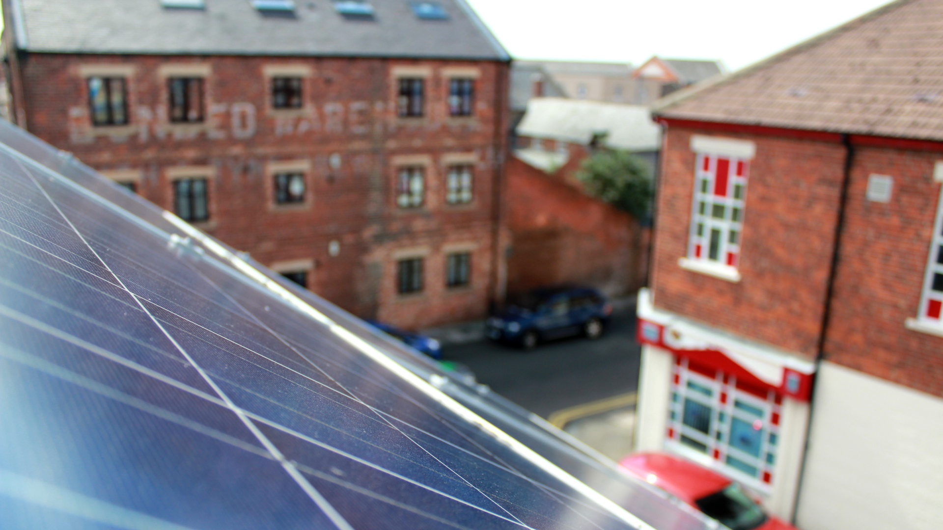 solar panel in front of two buildings