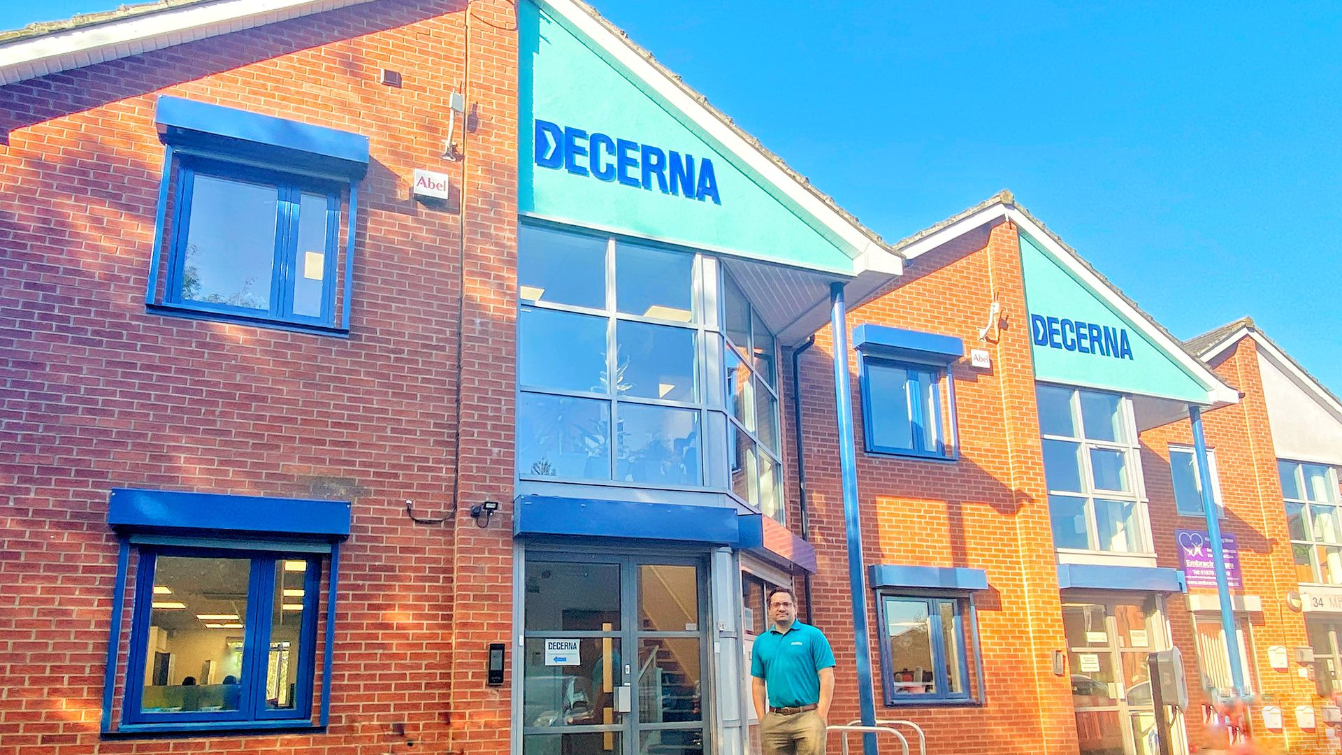 Image of Phil Norval from Decerna stood in front of the HQ of Decerna, known as Decerna House